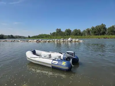 A nice clean rock solid unit. This zodiac comes with an 8 hp evinrude and a Minn Kota 38 lb thrust e...