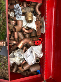 Box of plumbing copper elbows and unions