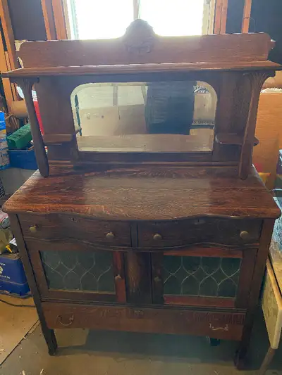 Quarter Oak sideboard, 1950's, Beveled mirror, Lead glass door. Large drawer on the bottom. Dimensio...