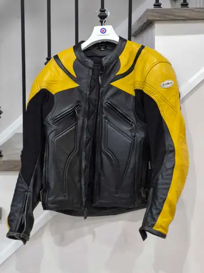 I am selling a First Racing motorcycle jacket, featuring a striking black and yellow design. This ja...