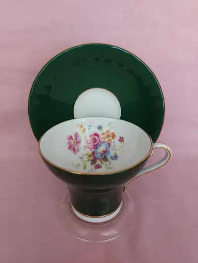 A vintage fine bone china cup and saucer by Aynsley , in dark green. It is in perfect condition. It...