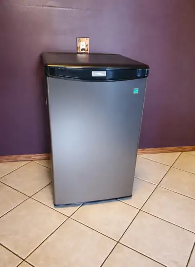 4.4 cu Danby Designer Stainless Steel Mini Fridge Energy Star rated Interior lighting Reversible doo...