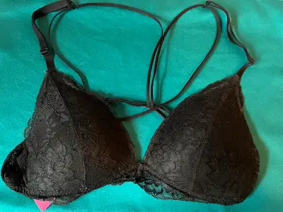 This is a La Senza black lace triangle bra in size small, perfect for adding a touch of elegance to...