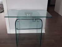 Solid glass accent table with shelf and swivel glass top.