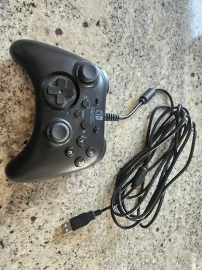 This is a used Nintendo Switch USB Controller that connects via USB, ensuring low latency. Perfect f...