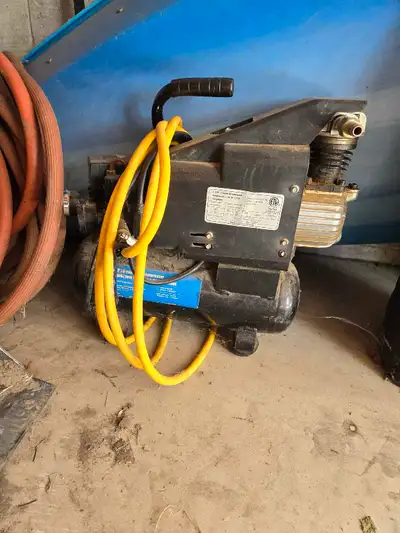 Old compressor needs tlc still holds air has yellow cable from photo (No other attachments included)