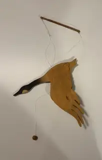 Beautiful handcrafted wooden bird designed to hang as a decoration. Lightweight and charming, it add...