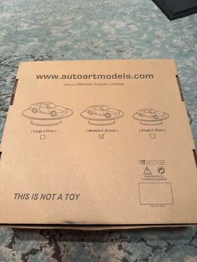 Showcase your prized collectibles with this AUTOart rotary display stand, designed to make your mode...