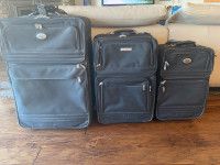 Three Black soft suitcases