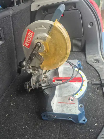 RYOBI mitre saw. Throat plate broken as shown. Otherwise works as should. Pickup just outside Amhers...