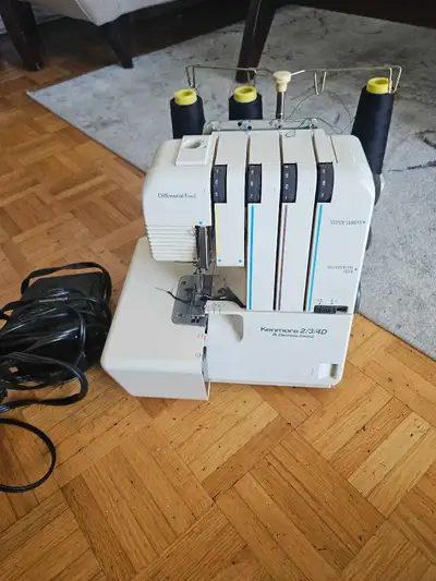 I'm selling a Kenmore 2/3/4D serger in used condition, perfect for adding professional finishing tou...