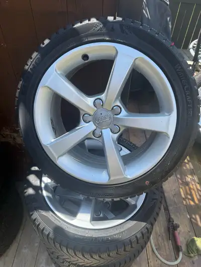 Almost new kumho winter tires with original audi alloy wheels