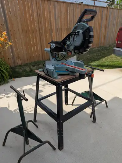 King Canada Compound Miter Saw with Sliding arm. Comes with table stand and 2 stands to hold longer...