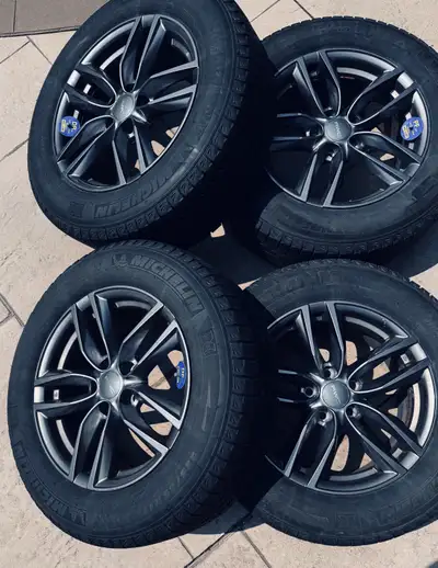Offering a set of winter tires, these are Michelin 225/65R17 on alloy rims (5x4.5 bolt pattern), pro...