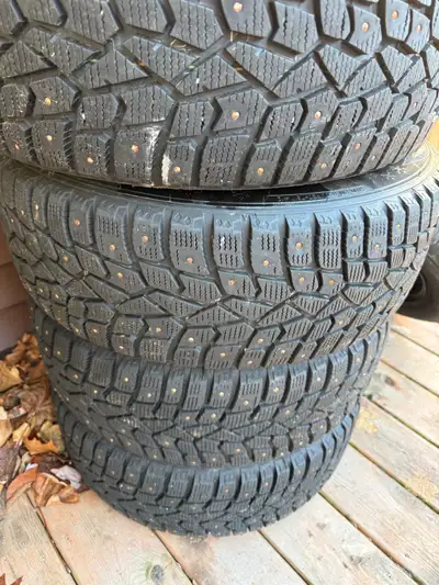 Barley used Sumitomo studded winter tires and rims. Bought last winter for my daughters car. Have le...