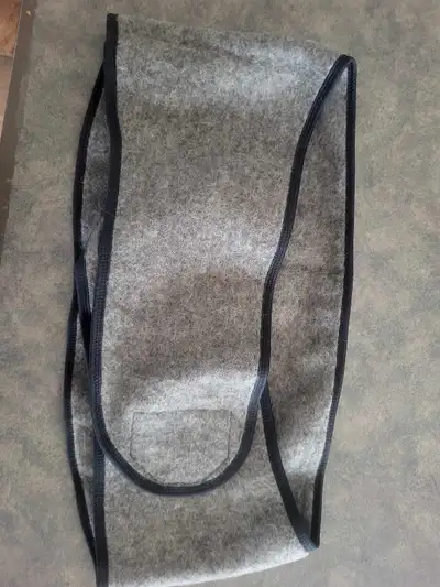 Never used. Adjustable from XL-XXXL. Made from natural wool.