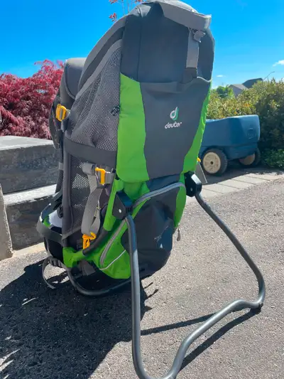 Deuter Kid Comfort Air. Child backpack carrier with one large storage pocket and several smaller sto...
