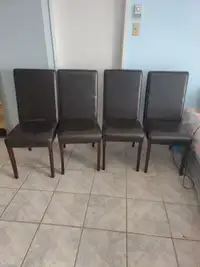 4 fake leather chairs. Color dark brown.  Great condition.