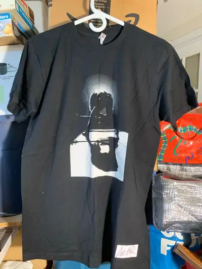 Check out this unique, Peter Hook T-shirt, featuring a striking graphic and Hooky 16 design on the b...