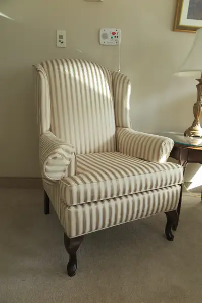 Wing chair with curvy legs, View more