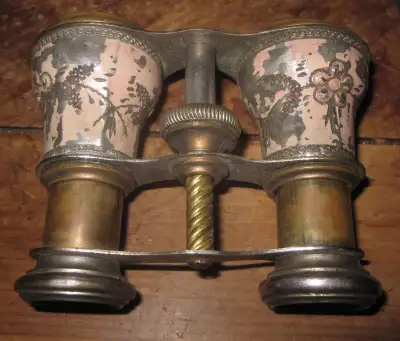 It's made of brass with some nickel plating, and the in and out mechanism works, it does zoom in wha...