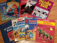 9 livres neufs , asterix, tintin,lucky luke ,garfield...