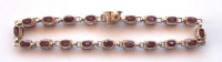 This 10K solid yellow gold and Burmese ruby tennis bracelet, is