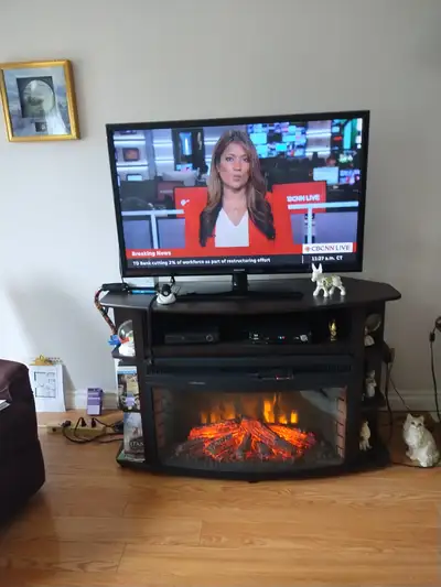 TV and stand with electric fireplace, View more