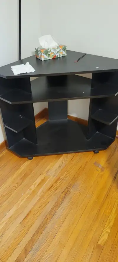 USED CORNER BLACK STAND CAN BE USED AS COMPUTER DESK/OR TV TABLe, View more