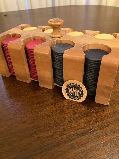 Elevate your game nights with this vintage Pla-M-Well poker chip set, complete with a stylish wooden...