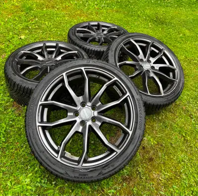 Used 1 winter only - Bridgestone Blizzak tires on rims. 225/40R18. Wheels 5x100mm. Already balanced,...