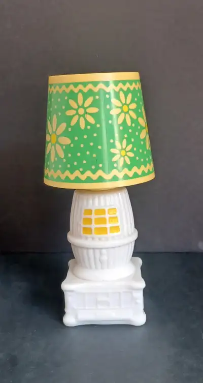 Vintage, Avon, pot bellied stove, cologne bottle with lamp shade top in green and yellow. Even has s...
