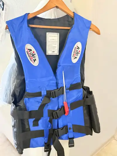 These blue and black adult life jacket are new out of package and ready for your next water adventur...