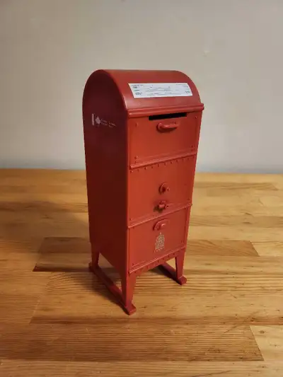 Vintage Canada Post miniature replica mailbox, which commonly functions as a piggy bank or a stamp d...