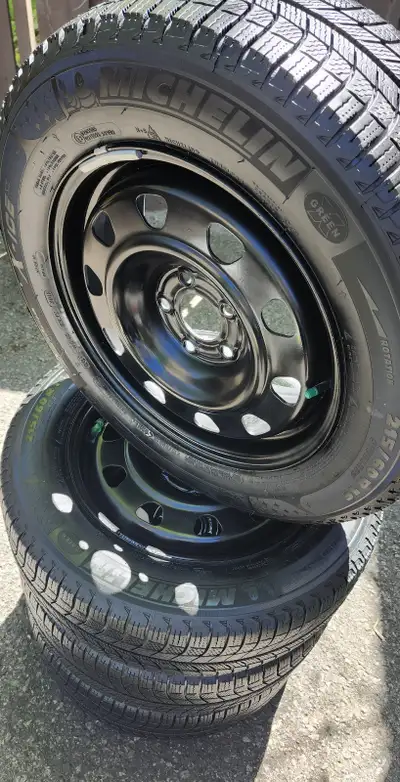 Almost New Michelin X-Ice Snow Tires with Black Steel Wheels 215 60 R16 Driven only one winter. Sell...