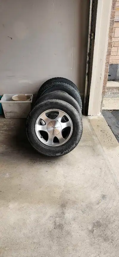 Selling a set of four used Ford Mustang rim wheels with tires. These wheels feature a classic 5-spok...