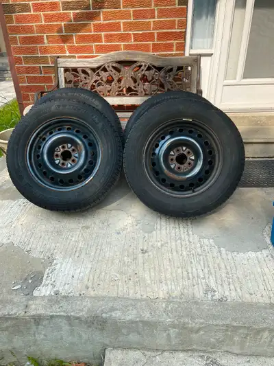 A set of winter tires mounted on a honda rims with tpms.