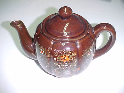 THIS VINTAGE TEAPOT WAS MADE IN JAPAN IN THE MID 1960'S. IT HAS AN ATTRACTIVE CHOCOLATE GLAZE WITH D...