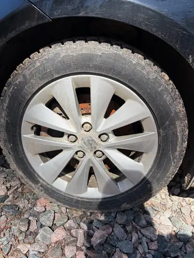 Selling rims with worn winter tires