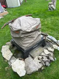  Older fire pit with cover 