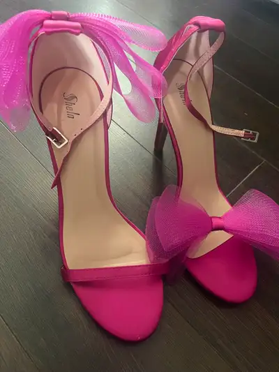 Pink heels with bows, bought the wrong size, never worn, size 9 womens, bought from SHEIN for 60 sel...
