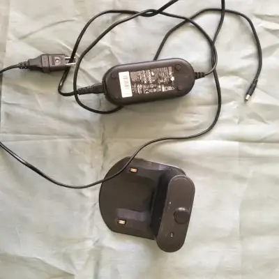 iRobot Roomba charger, model 17063. This charger includes the base station for docking and charging...