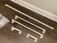 White towel bars, and toilet paper holders