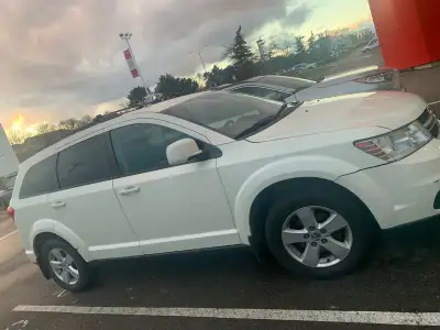 • Model: 2012 Dodge Journey (Version 2) • Color: White exterior with dark grey cloth interior • Owne...