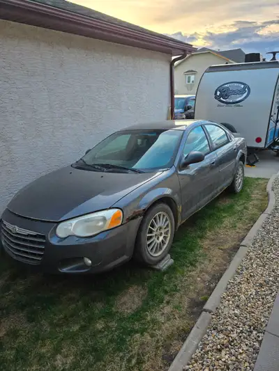 2005 chrysler sebring 250000kms 4 door car good for getting around blows hot heat cold ac Good tires...