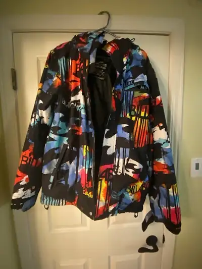 Multi-coloured Billabong ski and/or snowboard jacket in men's small size. This jacket features both...