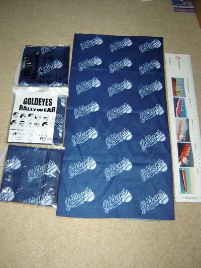 A bunch of Winnipeg Goldeyes Rallywear bandanas. They're more like a sleeve than a bandana. Blue. 1...