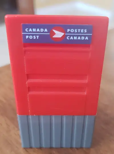 This is a Canada Post mini replica mailbox / stamp holder. Stands approx. 3 inches tall...excellent...