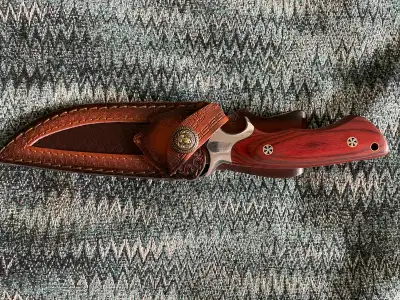NEW, never used camping/survival knife, handle- 13cm, blade- 14cm, total - 27cm, leather sheath, ste...
