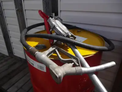 Selling a high output manual fuel pump with a clean 45 gallon steel drum, clean enough for gas or di...